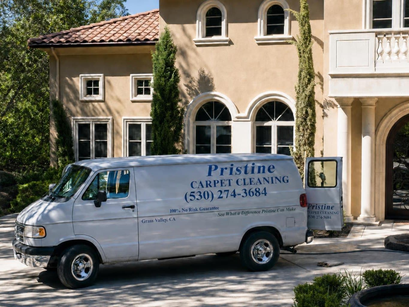 The Pristine Carpet Cleaning van parked on the driveway of a Grass Valley home